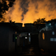 The cooling towers of the Dr Shyama Prasad Mukherjee Thermal Power Station as seen from the Patharripara Basti neighbourhood in Korba, Chhattisgarh, India.